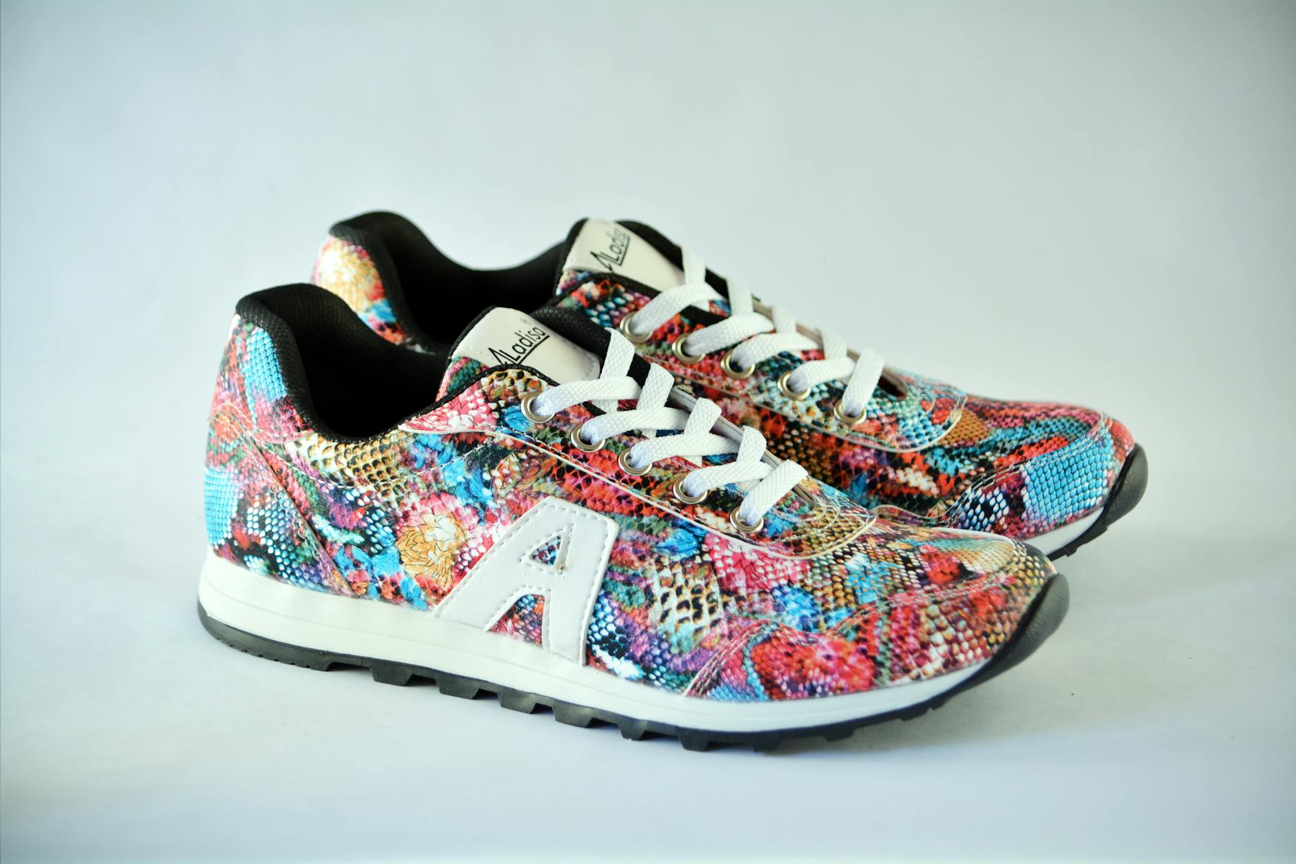 pair of multicolored low top sneakers